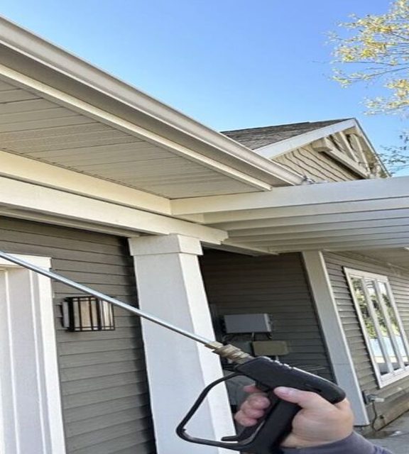 DeadOne technician treating the eaves of a Fort Wayne home