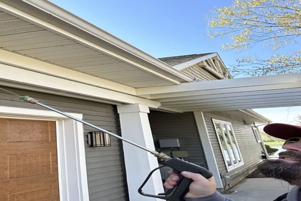 DeadOne technician treating the eaves of a Fort Wayne home